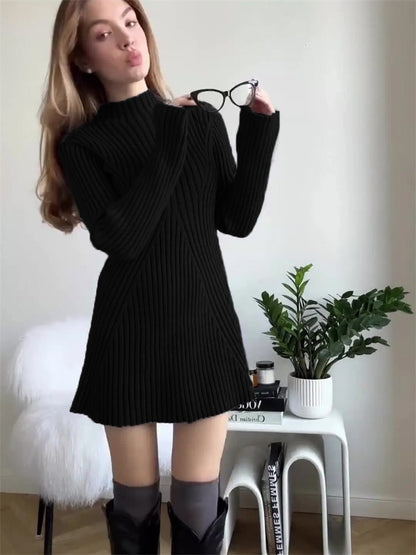 Long sleeved tight knit dress with a semi high collar and a base that covers the hips a solid color woolen dress