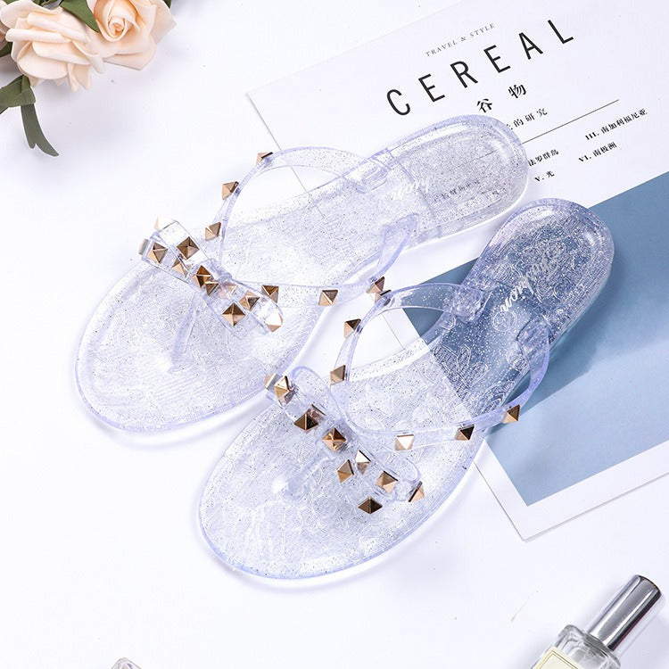 New style rivet shoes, bow shaped flip flops, summer beach outings, flat bottomed transparent jelly crystal slippers for women